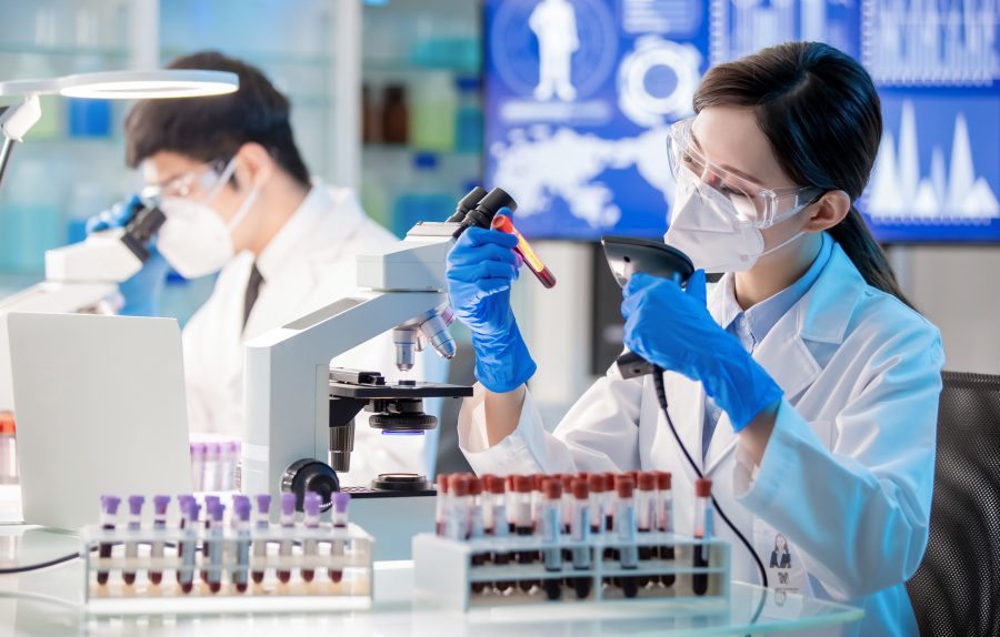 young female physician analyzes blood sample a