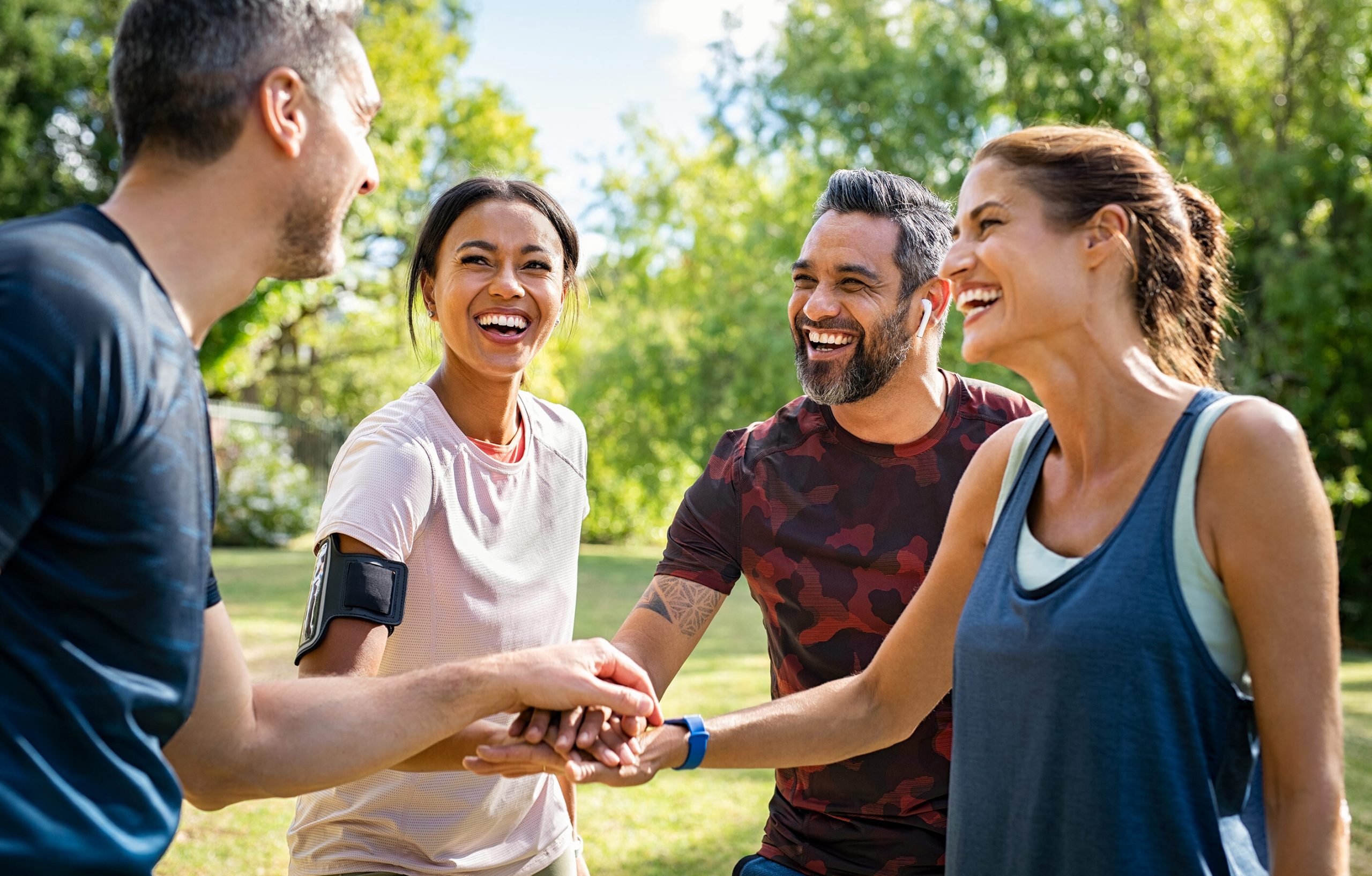 Friends outside huddling after playing a sport